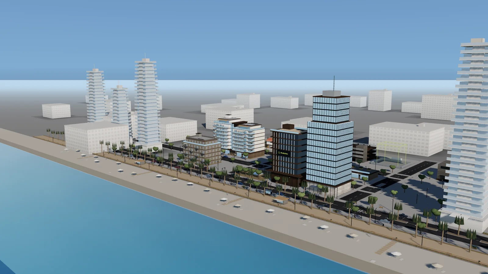 Vista a&eacute;rea del Distrito Mediafels: la playa, el paseo mar&iacute;timo y los edificios en venta